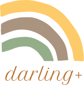 A yellow, brown and green rainbow with "darling+" beneath